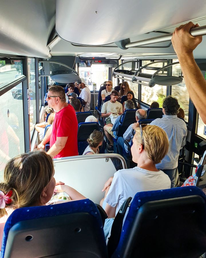 On a bus to Èze Village in France. There's people on every seat and some standing too. How to Navigate Public Transport in and Around Nice, France