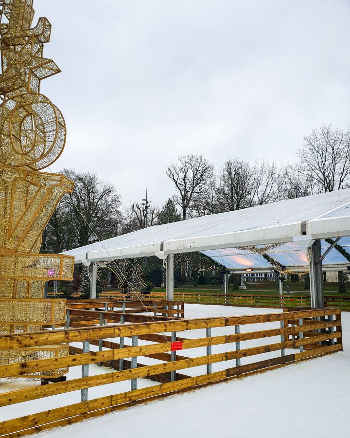 The ice-skating rink at a Christmas market in Luxembourg City. The ice is empty and there's a big LOVE sign on the left with a roof over part of the ice. Make the Most of Christmas in Luxembourg City
